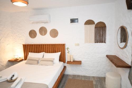 Cama o camas de una habitación en Mahzen Alaçatı