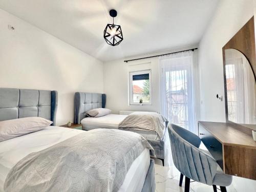 Postel nebo postele na pokoji v ubytování Ilidza Apartments - PEJTON RESIDENCE - Free Parking