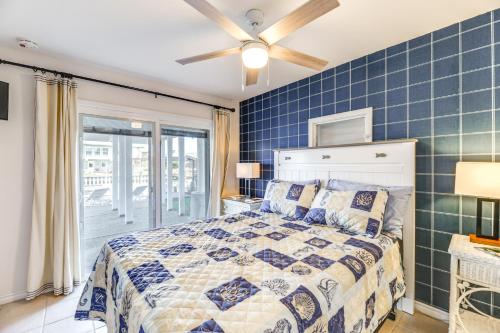a bedroom with a bed and a ceiling fan at Waterfront Home with Deck and Pool in City-by-the-Sea in City-by-the Sea