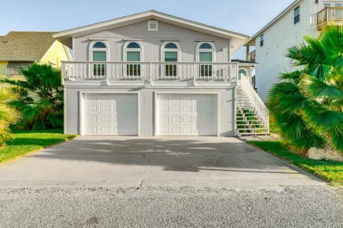 a large white house with two garage doors at Waterfront Home with Deck and Pool in City-by-the-Sea in City-by-the Sea