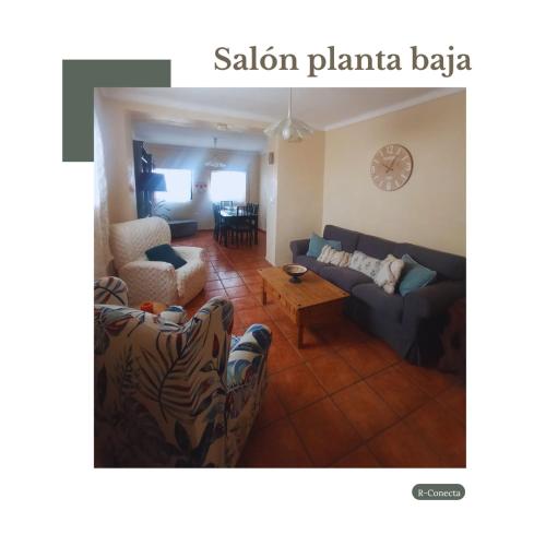 a living room with a couch and a table at Hostal R-Conecta in Cuevas de San Marcos