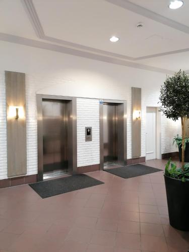 an empty lobby with elevators in a building at Penthousewohnung mit traumhaften Ausbilck auf den Segeberger See in Bad Segeberg