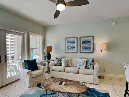 a living room with a couch and a table at Cassine Station 305 - Sea Ya in Santa Rosa Beach