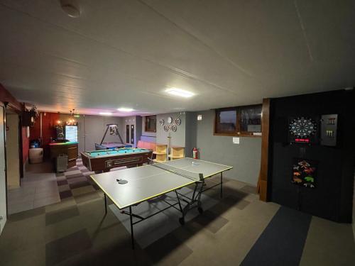 a living room with a ping pong table in it at Villa Agni in Barvaux