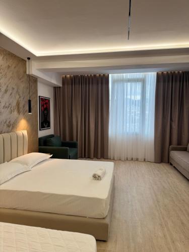 Un ou plusieurs lits dans un hébergement de l'établissement Moonlight Hotel