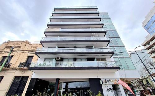 a tall building with balconies on the side of it at Nice Studio in Palermo Soho in Buenos Aires