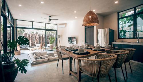 a dining room with a table and chairs in a kitchen at Tulum Jungle Luxury Villa Priv pool & Concierge 4B in Tulum