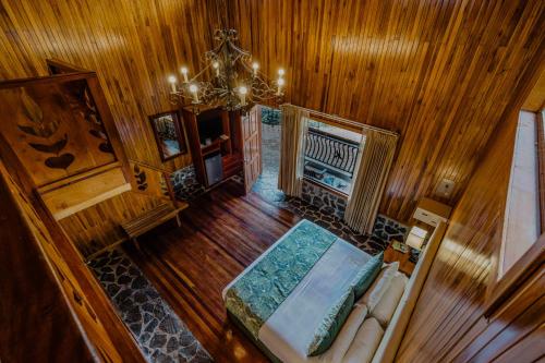 an overhead view of a living room with a chandelier at Hotel Heliconia - Monteverde in Monteverde Costa Rica