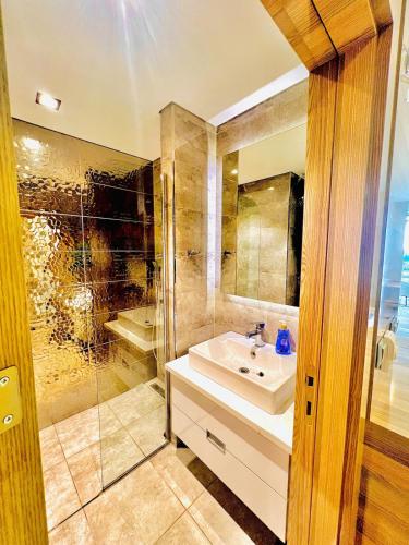 a bathroom with a sink and a shower at Cozy Studio in Esenyurt