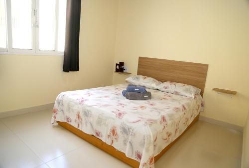 Ένα ή περισσότερα κρεβάτια σε δωμάτιο στο Casa em Nova Friburgo com piscina