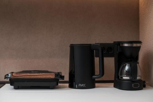 a coffee maker and a coffee pot on a counter at Villa il Borgο in Rhodes Town