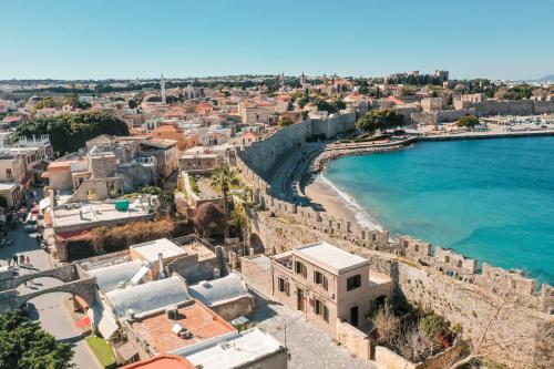 an aerial view of a city next to the ocean at Villa il Borgο in Rhodes Town