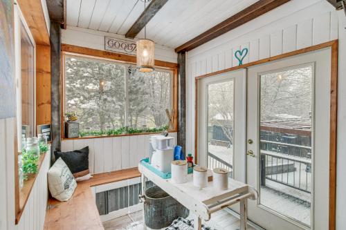 a tiny house with a table and a window at 11 Mi to Bozeman Family Home with Movie Room! in Belgrade