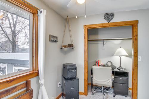 an office with a computer and a desk with a window at 11 Mi to Bozeman Family Home with Movie Room! in Belgrade