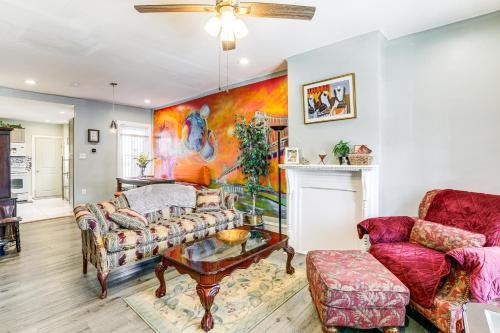 a living room with a couch and a table at 1 Mi to Philadelphia Zoo Convenient Townhome! in Philadelphia