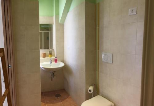 a bathroom with a sink and a toilet at B&B Sorgente 23 in Salerno