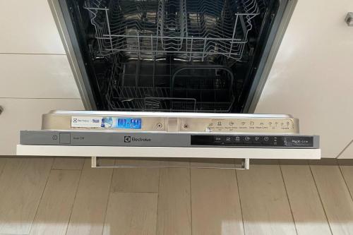 an oven with its door open in a kitchen at Beach Villa - By Bobbywashere in Santa Maria