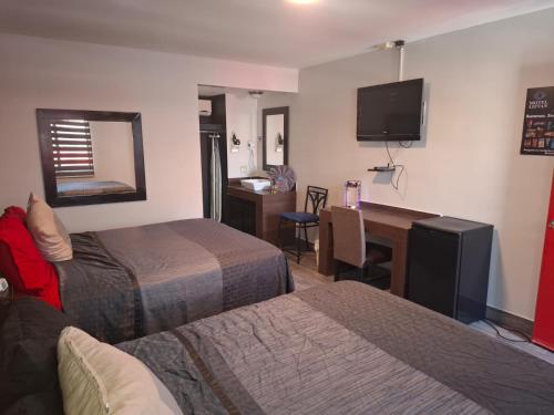 Postel nebo postele na pokoji v ubytování Lizvan Hotel-Motel