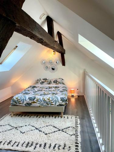 a bedroom with a bed in a attic at Vue incroyable Loire et Chateau in Amboise