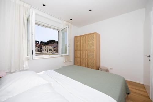 Postel nebo postele na pokoji v ubytování Apartment Apinelo