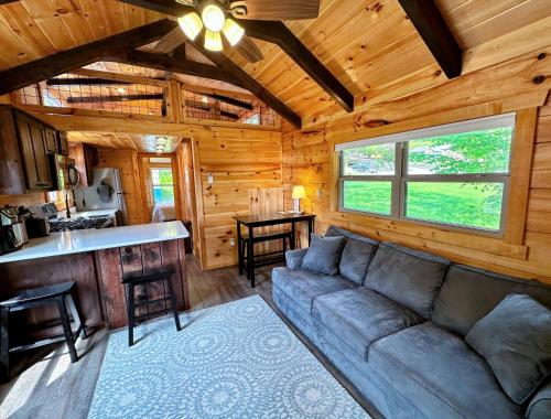 a living room with a couch and a kitchen at BMV6 Tiny Home Topline in Carroll