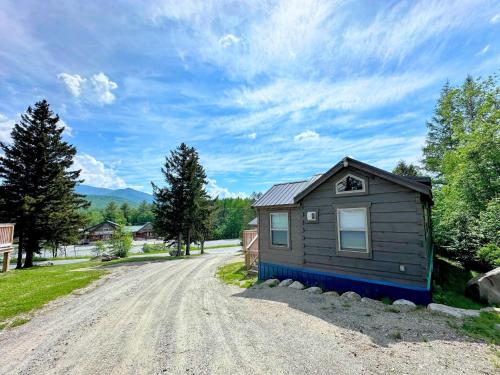a small house on the side of a dirt road at BMV7 Tiny Home Topline in Carroll