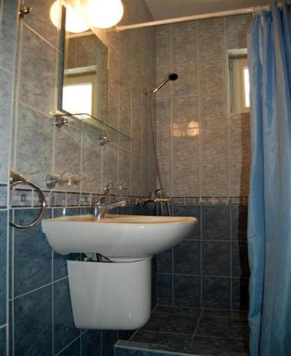 a bathroom with a sink and a shower at Family Hotel Diana in Pomorie
