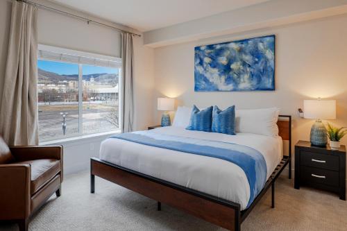 a bedroom with a large bed and a window at Convention Ctr Bespoke Beauty - 2BD Pool,Gym,Hot tub,Pkg in Salt Lake City