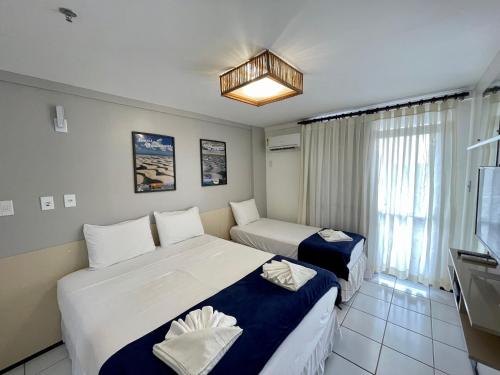 Katil atau katil-katil dalam bilik di Barreirinhas Lençóis Flat Residence