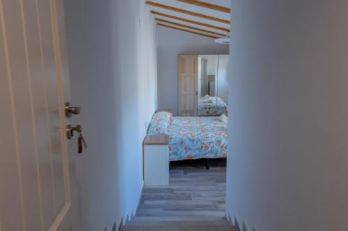 Ένα ή περισσότερα κρεβάτια σε δωμάτιο στο Hort de les Oronetes
