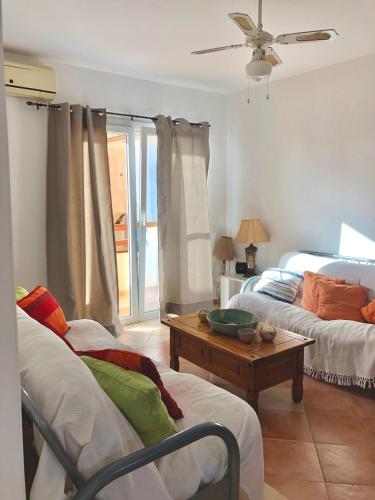 a living room with two beds and a table at Beachapartment fully serviced in Sal Rei