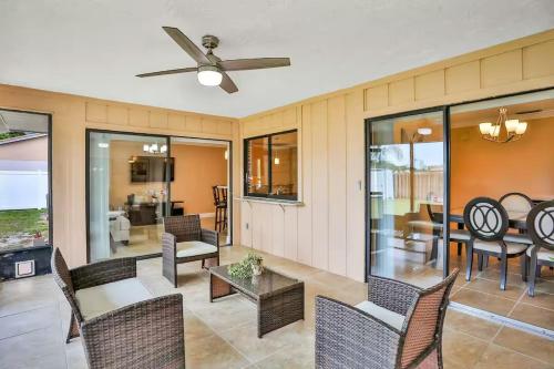 a living room with chairs and a ceiling fan at Renovated 3BR Dog Friendly Pond View WD in Whitfield