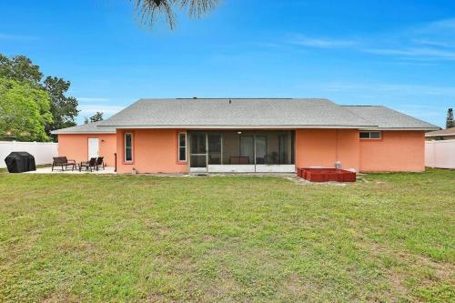 a house with a large yard in front of it at Renovated 3BR Dog Friendly Pond View WD in Whitfield