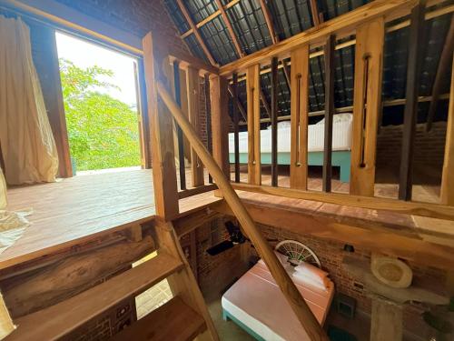 an inside view of a room with a window at villa ovita in Talpe