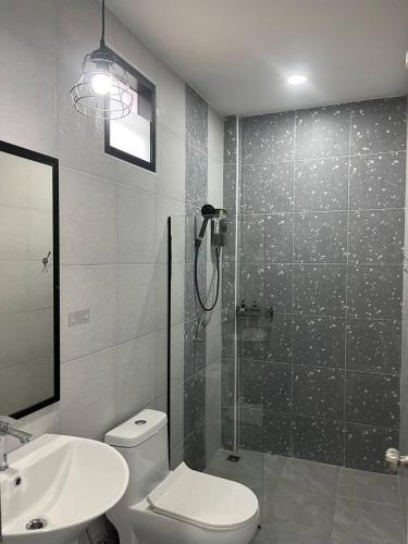 a bathroom with a shower and a toilet and a sink at Hillside Premium Hotel in Ban Huai Chiat