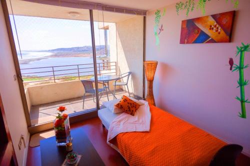 Llit o llits en una habitació de Excelente Vista al Mar 84