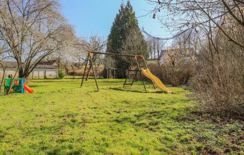 an empty playground with a slide in a field at Awesome Home In Hucqueliers With Wifi in Hucqueliers