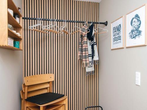 a room with a wall with a vertical stripes at 4 star holiday home in Fanø in Fanø
