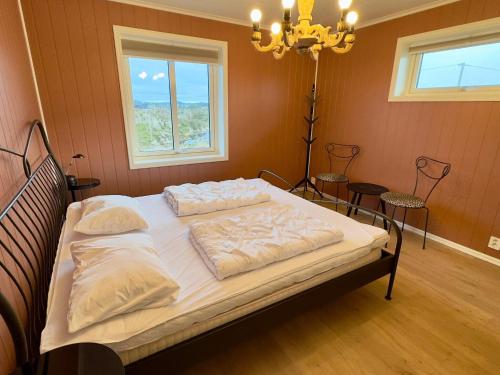 a bedroom with a bed with two pillows on it at 4 star holiday home in Tjeldstø in Tjeldstø