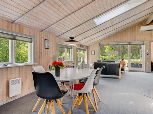 a dining room with a table and chairs at 6 person holiday home in Sæby in Sæby
