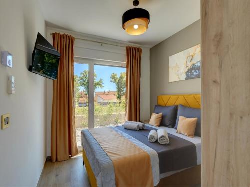 a bedroom with a bed with two towels on it at Villa in Marcana with Pool near Brijuni Park in Marčana