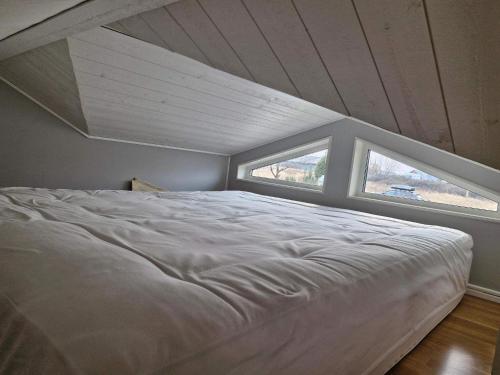 Un pat sau paturi într-o cameră la 4 star holiday home in KARLSKRONA