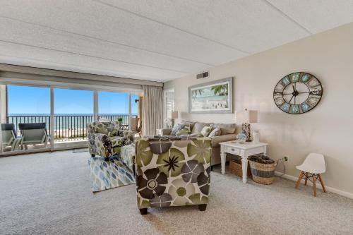a living room with a couch and a view of the ocean at G3 Amelia South condo in Fernandina Beach