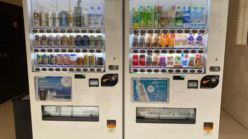 a vending machine filled with lots of bottles of soda at Toyoko Inn Nara Oji eki Minami guchi in Oji