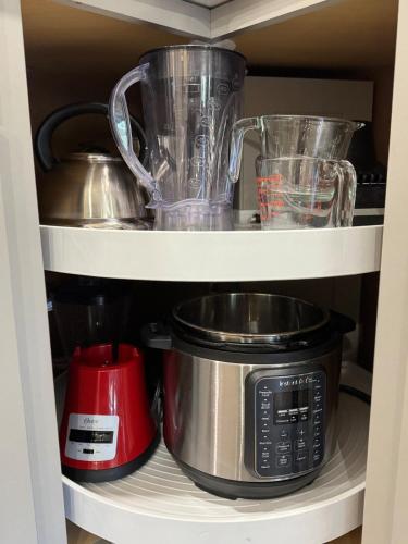 a cupboard with a blender and other kitchen utensils at Glacier Run, Hot Tub, Sauna,Movie Theater, WiFi, EV in Ashford