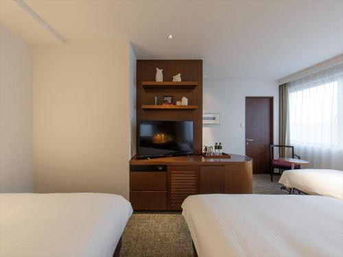 Katil atau katil-katil dalam bilik di JR Kyushu Hotel Kagoshima