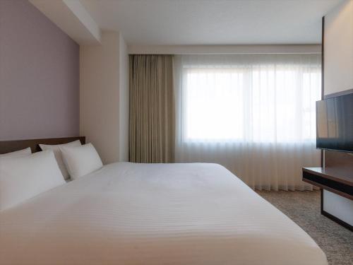 Katil atau katil-katil dalam bilik di JR Kyushu Hotel Kagoshima