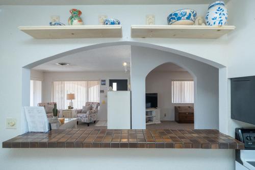 a kitchen and living room with an archway in a house at River Love, private dock Moovalya Keys in Parker
