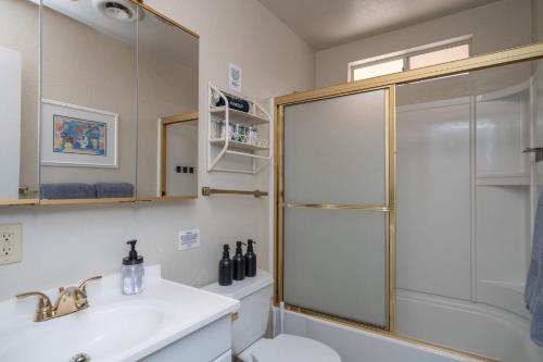 a bathroom with a shower and a toilet and a sink at River Love, private dock Moovalya Keys in Parker