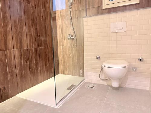 a bathroom with a shower and a toilet at Bohemia palace in Hurghada